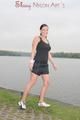 Enni outdoor wearing a sexy black shiny nylon shorts and a black top (Pics)