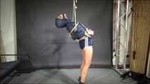 Marie bound, gagged and spanked in shiny nylon Shorts and a Windbreaker