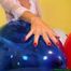 red fingernail popping of seven balloons