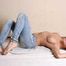 Topless barefoot Samira, cuffed with steel cuffs, poses to the camera