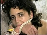 18 Yr OLD LATINA ZARR IS MOUTH STUFFED, LEATHER BELT GAGGED, BALL-GAGGED, OTM ACE BANDAGE WRAP GAGGED, WRISTS AND HANDGAGGED (D57-9)