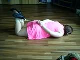 Sandra hogtied on the floor