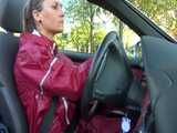 Watch Sandra taking a Walk during very hot Weather enjoying her rubberized oldschool Rainsuit