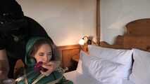 Rachel Adams tied and gagged in shiny Downwear