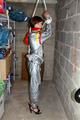 Nicole in an silver shiny PVC sauna suit tied and gagged in an cellar (Pics)
