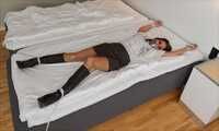 Spread eagle on bed