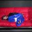 Sonja wearing a sexy blue raver shiny nylon pants and a black down jacket being tied, gagged and hooded on a sofa with ropes (Video)