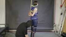 Lana bound and gagged in a shiny nylon Downvest