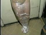 TINY TINA NAKED & MUMMY WRAPPED WITH PLASTIC WRAP & BLACK TAPE (D28-12)