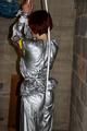 Nicole in an silver shiny PVC sauna suit tied and gagged in an cellar (Pics)