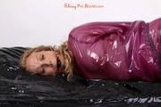 Sophie in an shiny transparent purple PVC suit tied and gagged in bed (Pics)