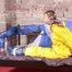 Alina tied, gagged and hooded on a princess bed in an old cellar wearing a shiny yellow rain combination (Pics)