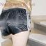 Mara wearing a sexy black shiny nylon shorts and a golden rain jacket tied and gagged with cuffs overhead (Pics)