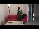 Enni dresses herself in shiny nylon shorts and rain cloths (Video)