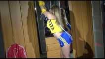 ***NEW MODEL*** Sandra wearing highheels and a sexy blue/yellow shiny nylon shorts and a yellow top tied and gagged with ropes (Video)