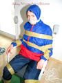 Katharina tied by using tape, gagged and hooded on a chair wearing sexy red/blue rainwear (Pics)