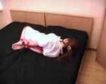 Barefoot nurse Gatitta tied up with a red rope (video)