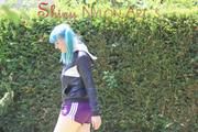 Mara wearing a purple shiny nylon shorts and a black rain jacket playing soccer (Pics)
