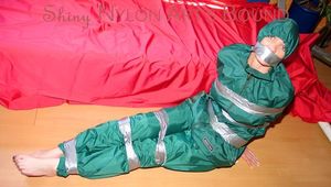 Jill tied, gagged and hooded on a sofa with tape wearing supersexy shiny nylon oldschool rainwear (Pics)
