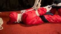 Sebastien breathplay in a red PVC jumpsuit.
