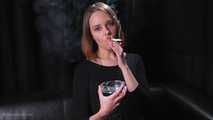 Dasha is smoking in the studio