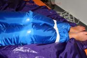 Alina tied and gagged in a shiny skisuit