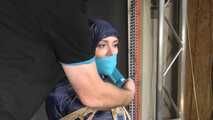 Marie bound and gagged in shiny nylon Rainwear