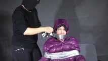 Rachel Adams caught, bound and gagged in a shiny nylon Downjacket