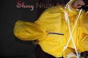 Sandra being tied and gagged on a hairdresser´s chair wearing sexy yellow shiny nylon rainwear being double hooded (Pics)