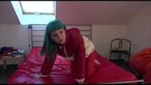 Watching sexy Mara during a photo shooting wearing a sexy red shiny nylon rainpant and an oldschool red/white shiny nylon down jacket posing infront of the camera (Video)
