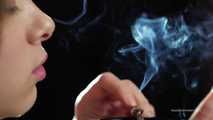 A young lady showing her smoking skills in a closeup video 