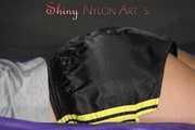 Watching Pia preparing her bed wearing a sexy black shiny nylon shorts and a grey tshirt (Pics)