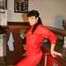 Jill posing in a bar wearing a sexy red rainwear combination with nothing under it (Pics)