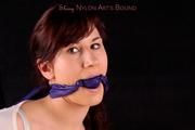 Julia tied and gagged in purple shorts