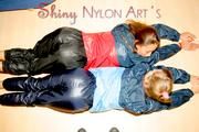 Stella and Leonie having fun with eachother wearing sexy shiny nylon rainwear (Pics)