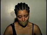 18 Yr OLD STUDENT SHANNA IS WRAP TAPE GAGGED, DUCT TAPE TIED, BAREFOOT, TOE-TIED, HANDCUFFED, MOUTH STUFFED, HANDGAGGED WHILE SITTING ON THE BED (D67-15)