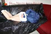 LUCY tied and gagged with ropes and a cloth gag wearing a supersexy white shiny nylon shorts and blue rain jacket (Pics)