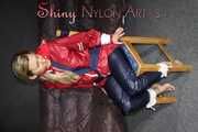 Sexy Sandra wearing sexy red/blue rainwear being tied and gagged with ropes and a clothgag on a chair (Pics)