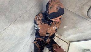 Myxxxy got a messy experience in nylon Rainwear. I bound and gagged her with tape in a shiny nylon Rainsuit and served her a chocolate pudding. 