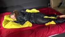 Sexy Sandra wearing sexy shiny nylon rainwear lolling in bed of nylon (Pics)