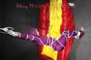 Watching sexy Sonja wearing a supersexy purple shiny nylon rainwear combination being tied and gagged overhead with ropes and a clothgag (Pics)