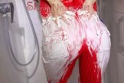 Sonja taking a shower after messy up her shiny nylon jumpsuit with shaving cream (Video)