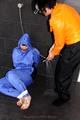 Jill bound and gagged by Simone in shiny nylon rainwear