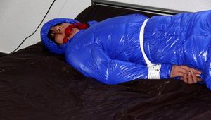 Simone tied and gagged in a shiny nylon downcoat