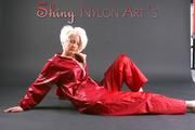 Blonde archive girl posing in a studio wearing a sexy red AGU rainwear combination (Pics)