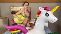 nail2pop promotional balloons on inflatable unicorn and destroying it with a pen