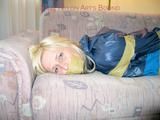 Archive girl tied and gagged with tape and rope wearing shiny nylon rainwear in blue (Pics)