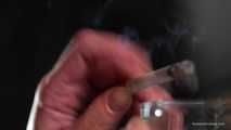 Smoking 100mm Marlboro Red in this closeup video 