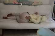 SEXY Jill wearing a WHITE rain pants and a WHITE down jacket lolling on the sofa playing with you (Pics)