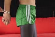 Julia tied and gagged in shiny nylon shorts
